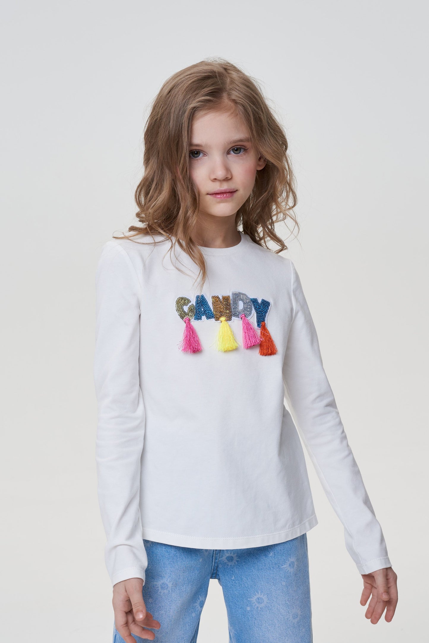 Long-sleeve tee decorated with Candy lettering and ruffles