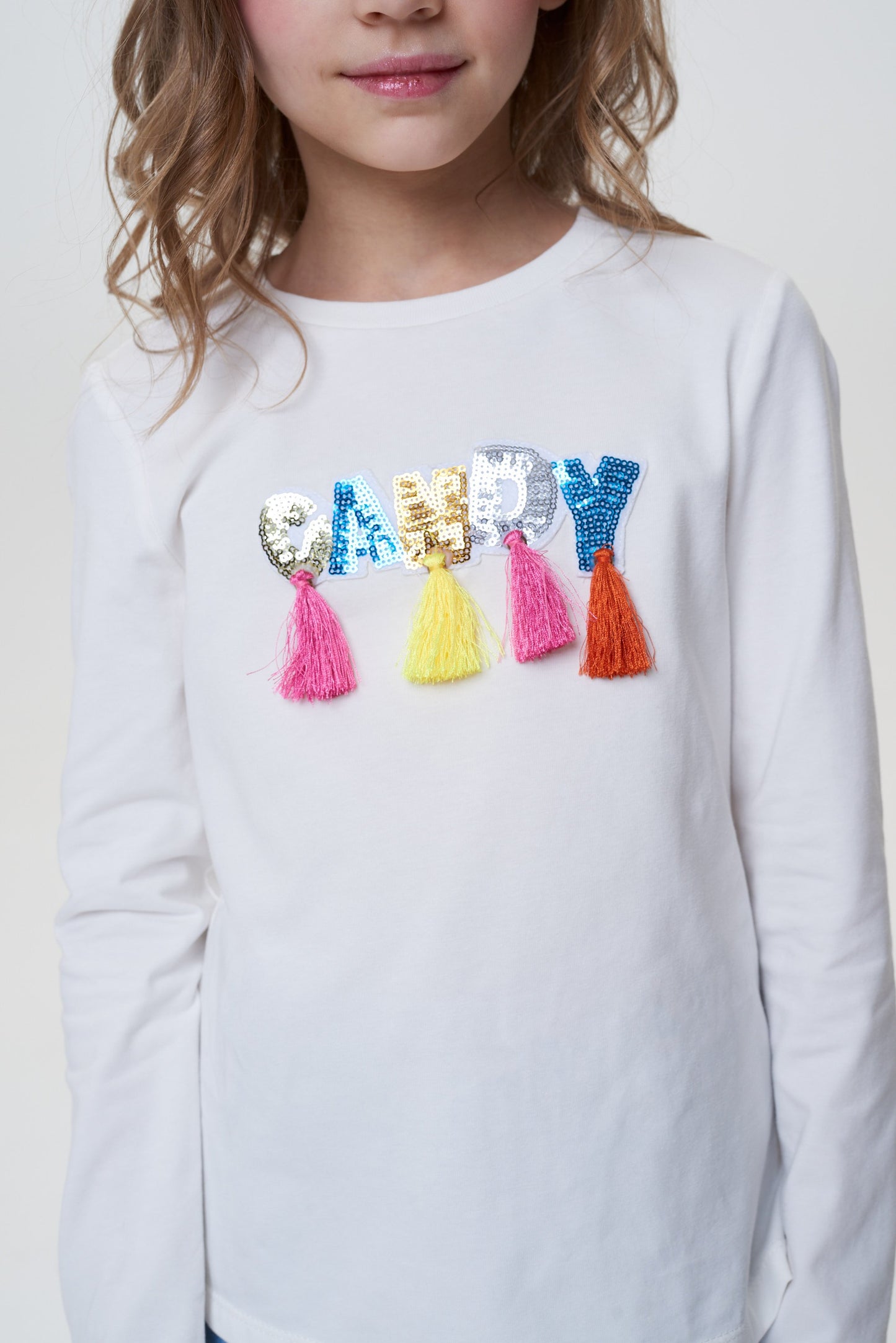 Long-sleeve tee decorated with Candy lettering and ruffles